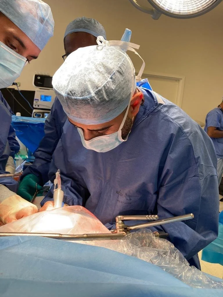 Mr Farid performing surgery